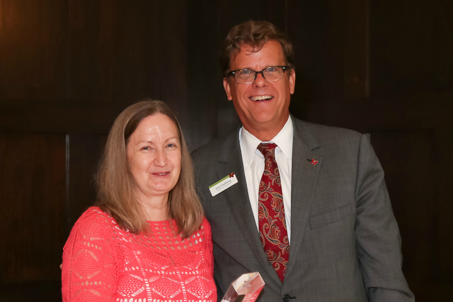 John Hallberg delivering the Butterfly Award to JoAnn Schultz