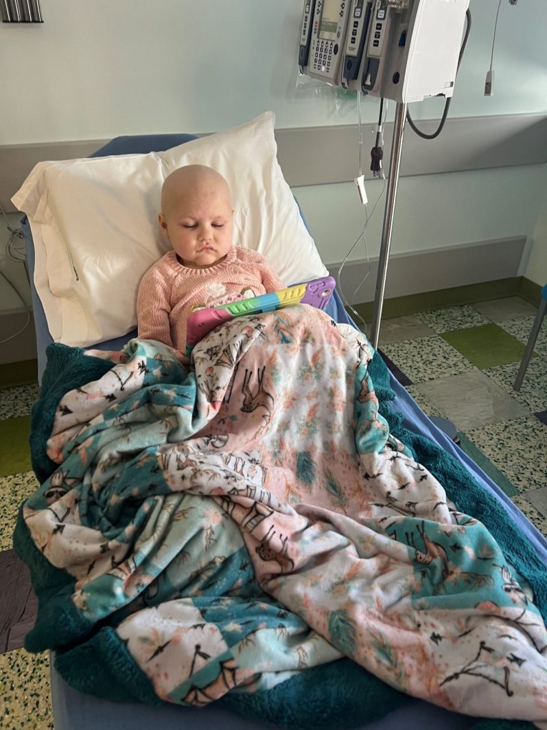 Bryleigh in her hospital bed